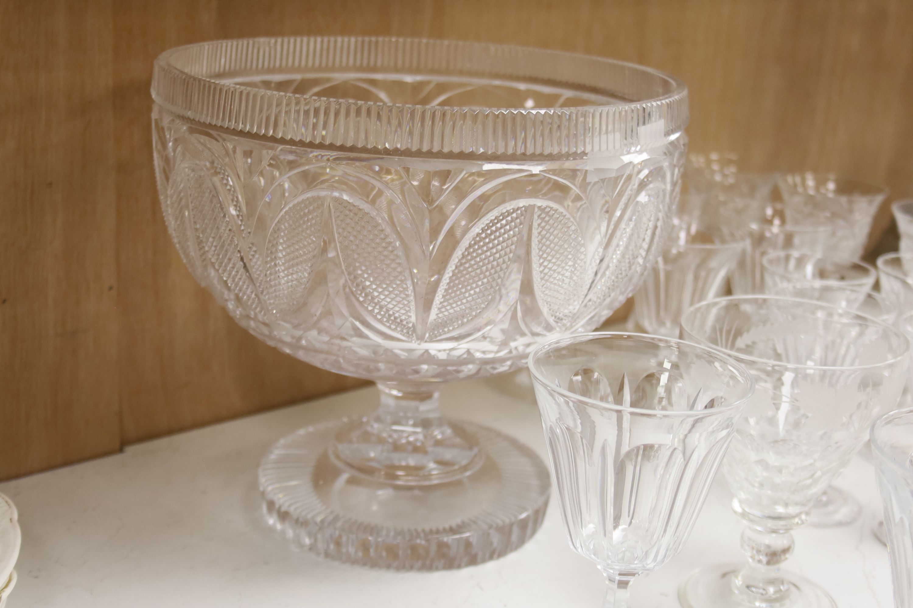 A cut glass punch bowl and a collection of table glassware, to include a late Victorian silver mounted decanter (lacking stopper)